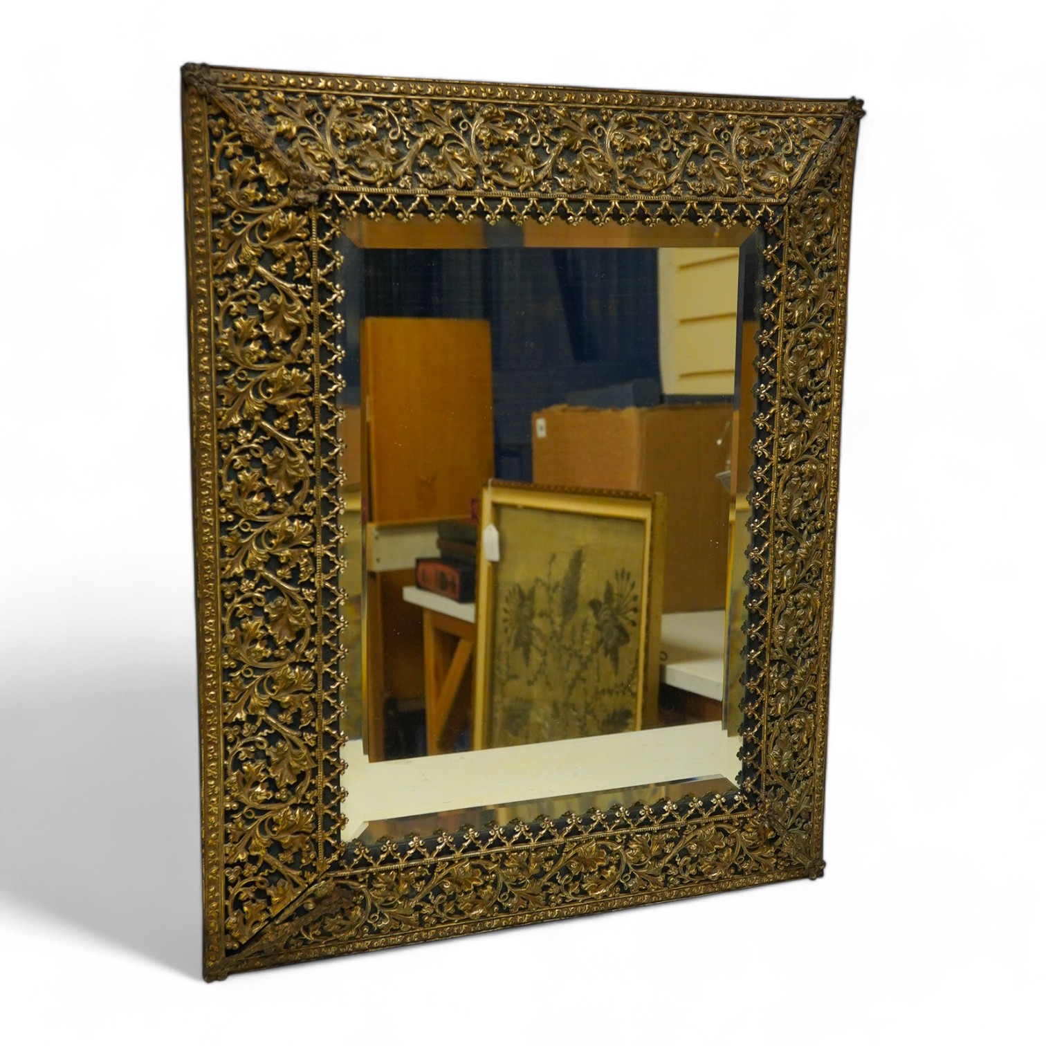 A period-style embossed metal easel mirror, 41cm x 50cm. Condition - easel stand missing now converted to a wall mirror